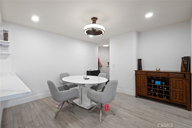 dining room with light hardwood / wood-style flooring