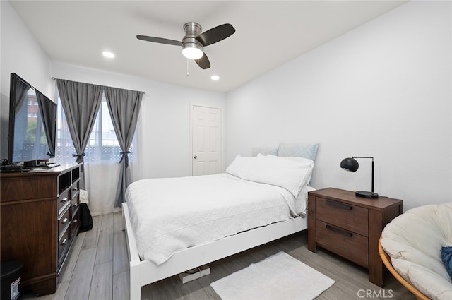 bedroom featuring wood-type flooring and ceiling fan