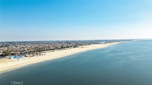 birds eye view of property with a beach view and a water view