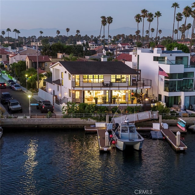 exterior space featuring a water view and a residential view