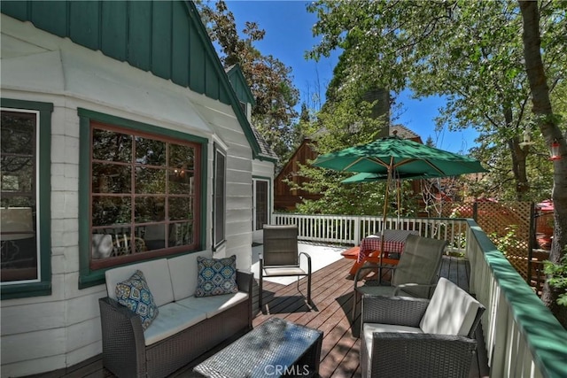 deck featuring outdoor lounge area