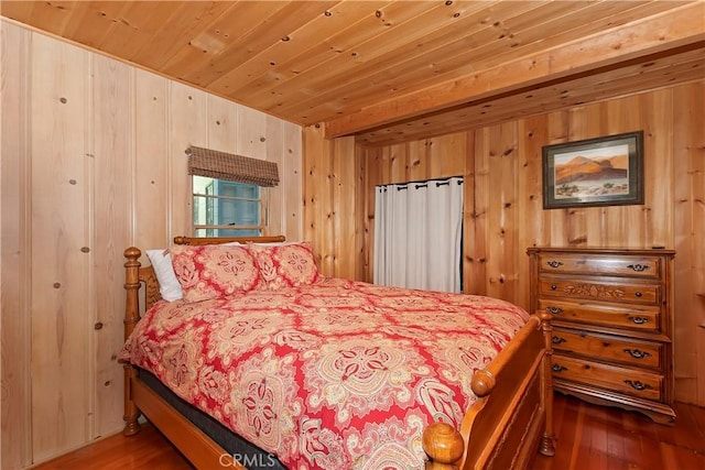 bedroom with hardwood / wood-style floors, wood ceiling, and wooden walls