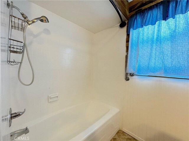 bathroom featuring tile patterned floors and shower / bath combination