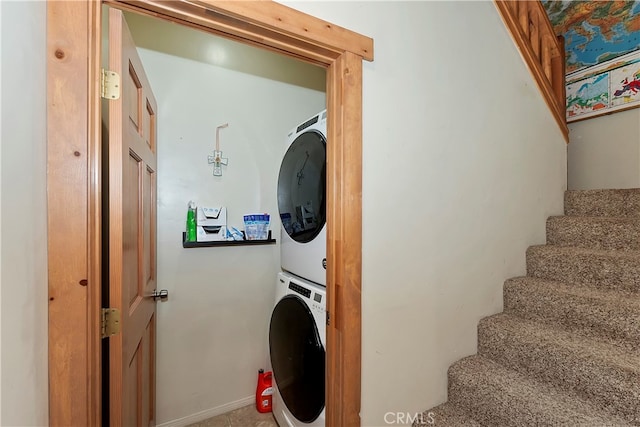 laundry room with stacked washer / dryer