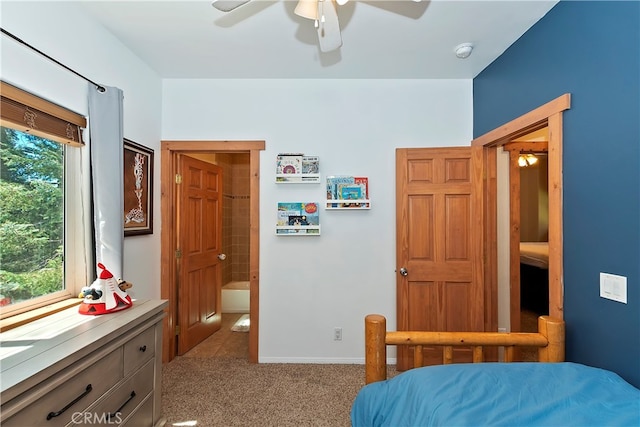 carpeted bedroom featuring multiple windows and ceiling fan