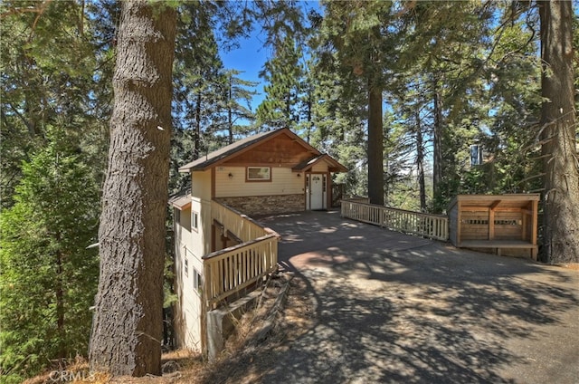 view of front of property featuring a wooden deck