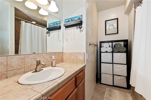 bathroom with vanity, tile patterned floors, and decorative backsplash