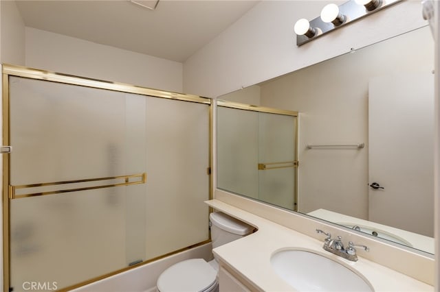 full bathroom with vanity, combined bath / shower with glass door, and toilet