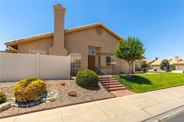 view of front of home with a front lawn