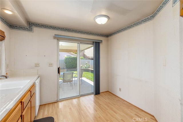 doorway to outside with light wood-type flooring