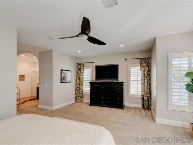 bedroom featuring light carpet and ceiling fan