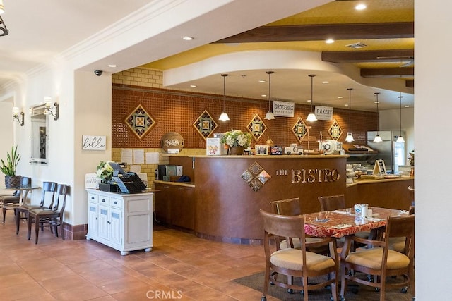 interior space featuring tile patterned floors, crown molding, beamed ceiling, and recessed lighting