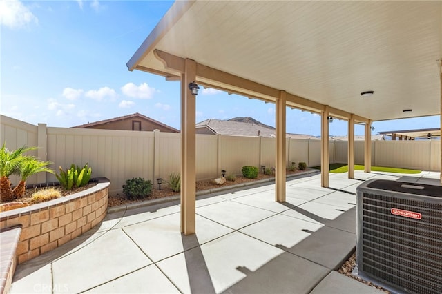 view of patio / terrace featuring a fenced backyard and central AC