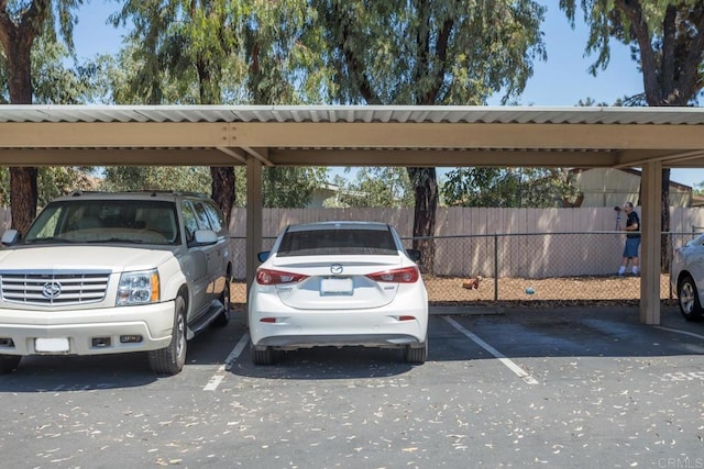 view of parking / parking lot with a carport