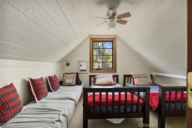 bedroom featuring ceiling fan, lofted ceiling, and wooden ceiling