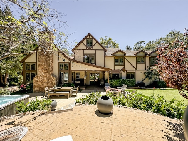 back of house featuring a patio area