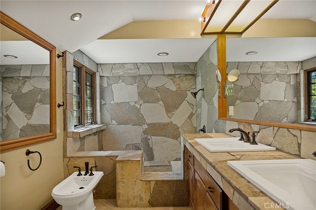 bathroom featuring a bidet and vanity