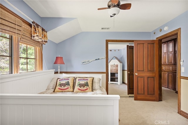 carpeted bedroom featuring vaulted ceiling and ceiling fan