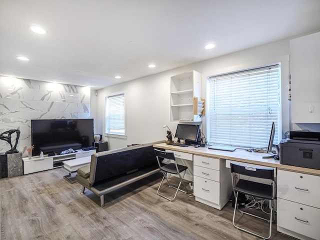 office space with light hardwood / wood-style flooring and plenty of natural light