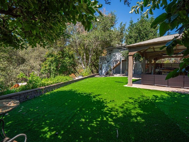 view of yard with a gazebo and a patio area