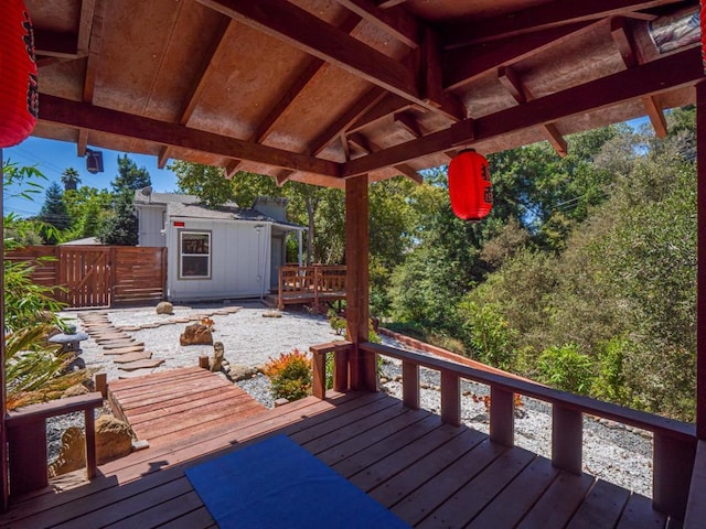 wooden terrace with an outdoor structure