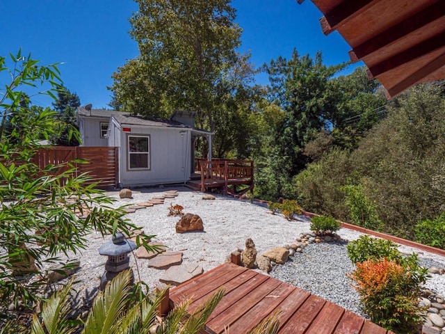 view of yard featuring a wooden deck