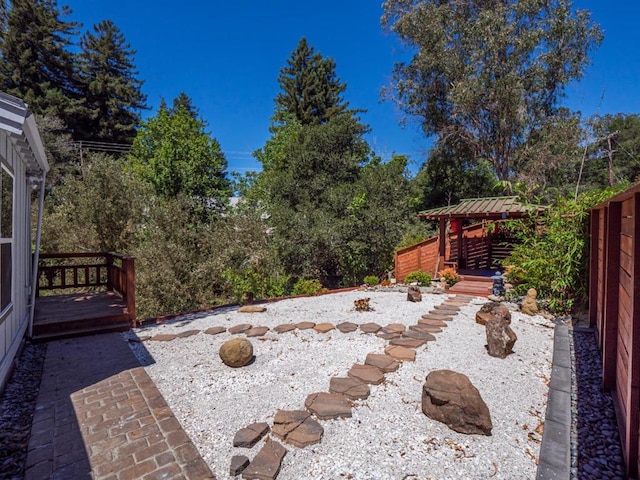 view of yard with a gazebo and a deck