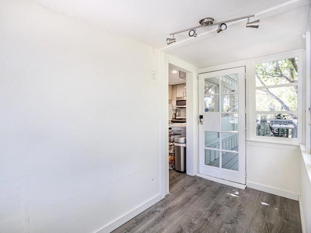 doorway to outside with hardwood / wood-style flooring