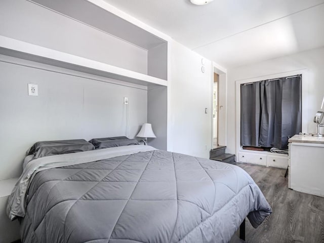 bedroom featuring dark wood-type flooring