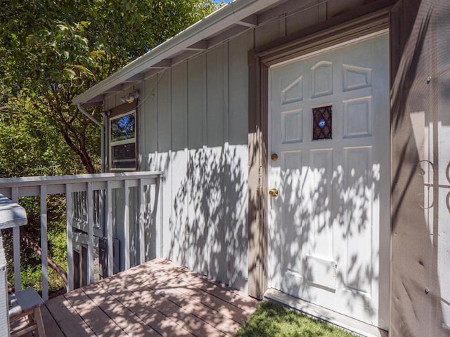 doorway to property featuring a wooden deck