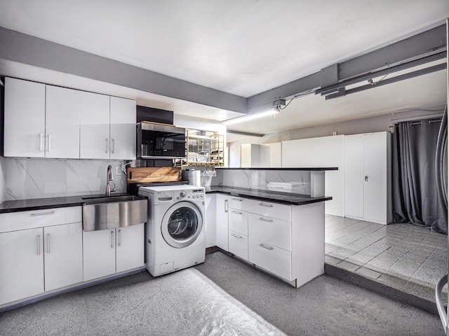 laundry room featuring washer / clothes dryer and sink