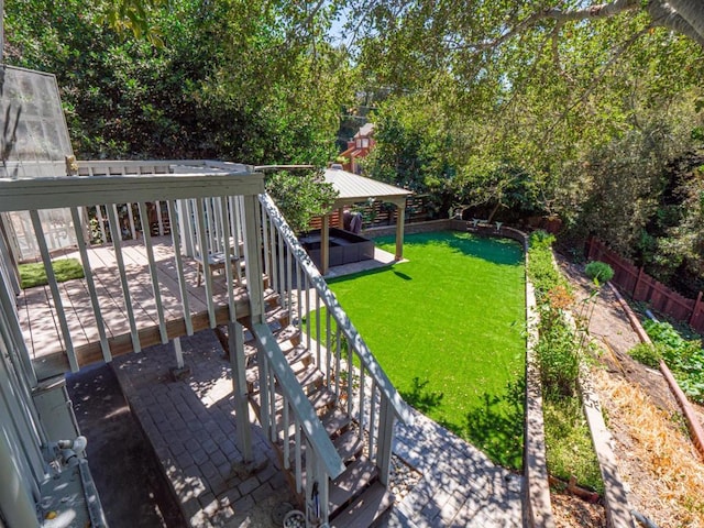 view of yard featuring a jacuzzi and a patio