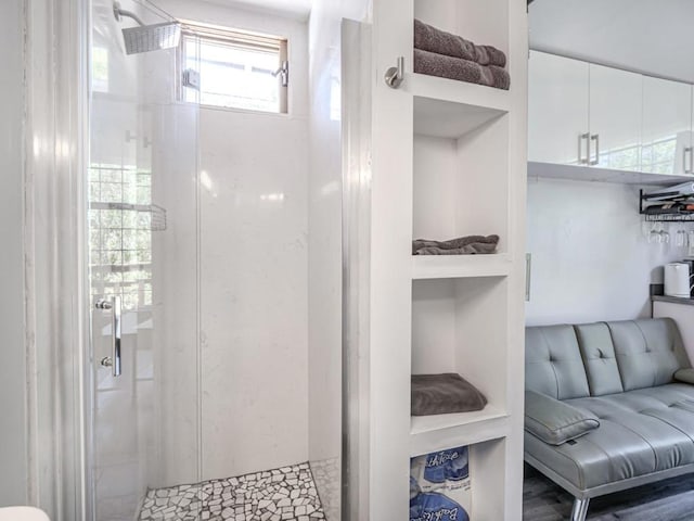 bathroom with tiled shower