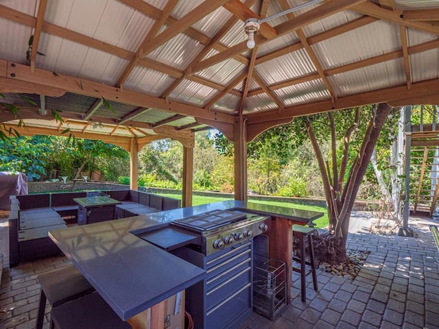 view of patio with a gazebo and an outdoor bar