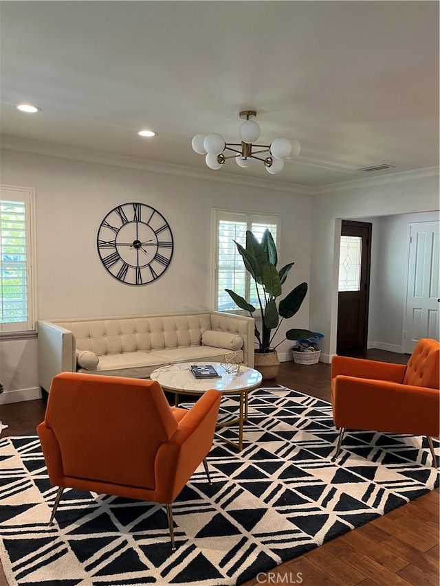 living room featuring ornamental molding, dark hardwood / wood-style floors, and a healthy amount of sunlight