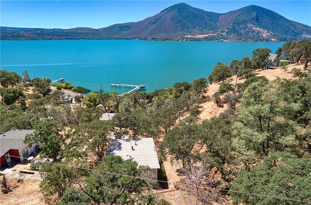 aerial view featuring a water and mountain view