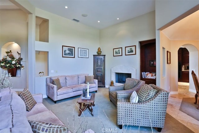 living room with a towering ceiling