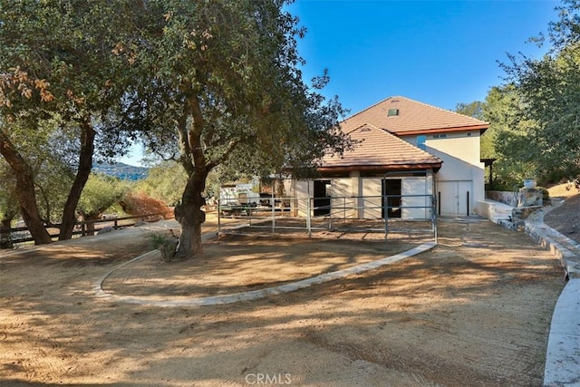 41565 Avenida Conchita, Murrieta, CA 92562 - rear view of house with an exterior structure, stucco siding, and an outdoor structure