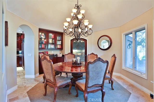 dining area featuring a chandelier