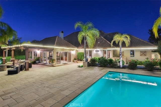 41565 Avenida Conchita, Murrieta, CA 92562 - pool at night with an outdoor pool, a patio, and outdoor lounge area