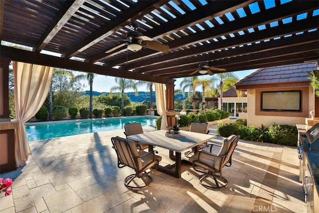 view of patio / terrace featuring a pergola, ceiling fan, and a mountain view