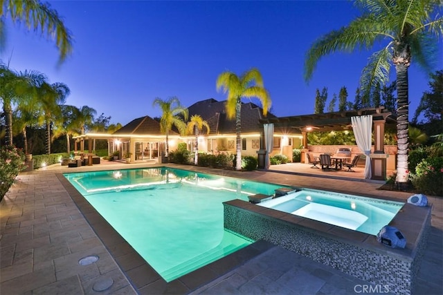 41565 Avenida Conchita, Murrieta, CA 92562 - pool at night with a patio area and a pool with connected hot tub