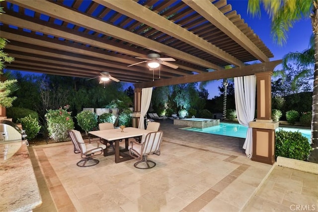 41565 Avenida Conchita, Murrieta, CA 92562 - patio at night with a ceiling fan, a patio area, a pool with connected hot tub, and outdoor dining area