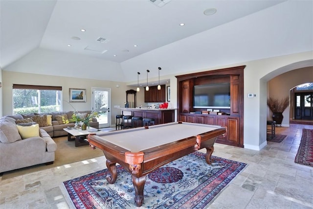 game room featuring bar area, lofted ceiling, and pool table