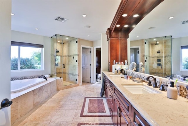 bathroom featuring tile patterned floors, vanity, and independent shower and bath