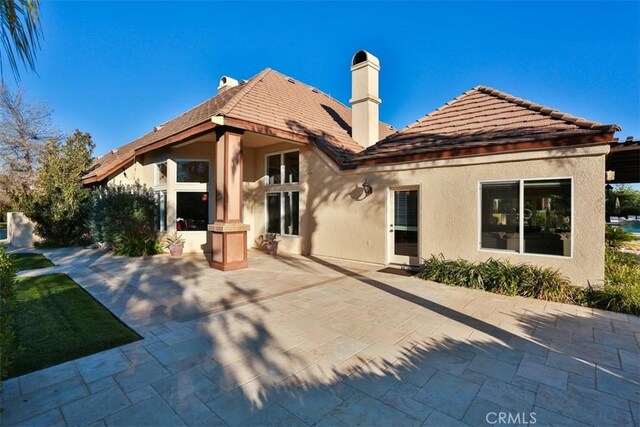 rear view of property with a patio