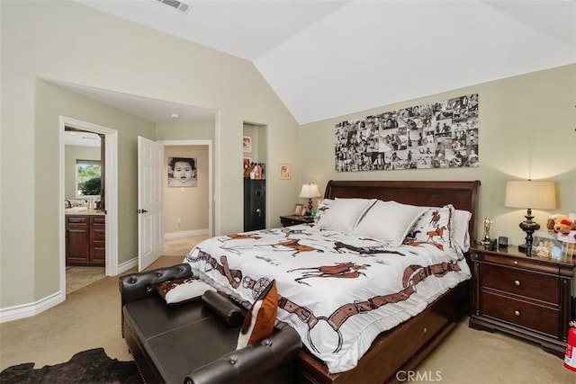41565 Avenida Conchita, Murrieta, CA 92562 - bedroom featuring light carpet, lofted ceiling, baseboards, and connected bathroom