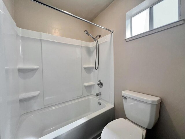 bathroom featuring  shower combination and toilet