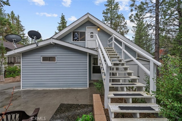 rear view of house with stairway