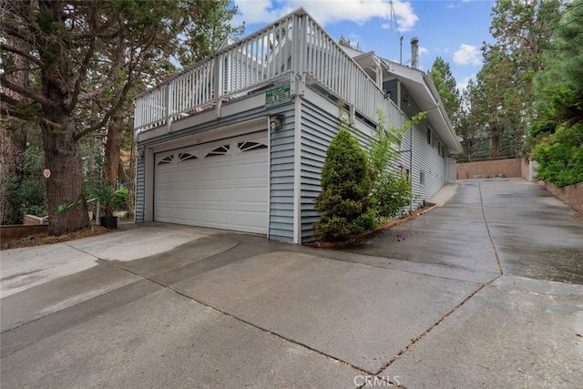 view of property exterior featuring driveway